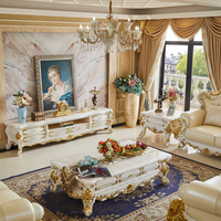 Meuble TV en bois massif de style européen, table basse de luxe en marbre blanc sculpté couleur or champagne, et armoire de sol combinée pour salon