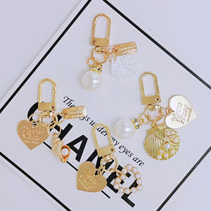 Mignon Perle Shell AirPods Pendentif Créatif Petit Porte-clés En Métal En Gros Ins Métal Bijoux Alliage Décapsuleur Idée Cadeau - Product Image 1