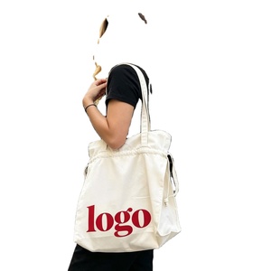 Sac fourre-tout promotionnel en toile de coton personnalisé avec fermeture à bandoulière et motif lettres, idéal pour les cadeaux et la publicité, vente en gros pour fabricants - Product Image 1