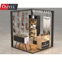Kiosque à parfum rotatif moderne sur mesure, conception et fabrication avec mur en verre, présentoir pour centre commercial