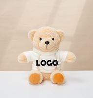 Ours en peluche avec logo personnalisé de l'usine de jouets en peluche professionnels 22cm Animal en peluche doux en chemise blanche et noire à capuche pour les anniversaires