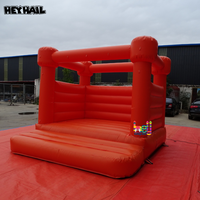 Château gonflable orange vif en PVC commercial durable, idéal pour toutes sortes de fêtes et d'événements