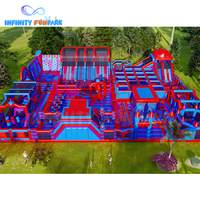 Glissière géante d'île d'aventure gonflable bleu rouge d'enfants nouvellement populaires + parc à thème gonflable de service d'OEM de piscine à balles