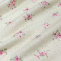 Tissu jacquard côtelé à pointelle imprimé de petits motifs floraux jaunes en maille 95% polyester 5% élasthanne OEKO-TEX pour vêtements de détente et pyjamas