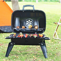 Barbecue portable moderne en fer noir avec double grille et poignée pliable pour le camping