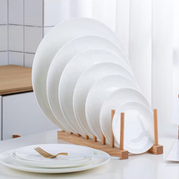 Assiette Ronde Plate en Porcelaine Fine Blanche de Luxe Minimaliste de Haute Qualité pour Service de Dîner et Utilisation au Micro-ondes (Vente en Gros)