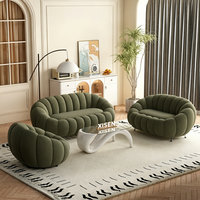 Ensemble de canapés Boucle crème incurvés avec table basse en verre pour salon, salon de beauté, centre commercial, mobilier de salon de loisirs