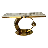 Table à manger en pierre frittée de luxe avec support en acier doré, design moderne pour la maison et l'hôtellerie