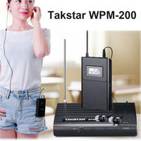 Système de monitoring intra-auriculaire Takstar WPM-200 avec émetteur sans fil 6 canaux et microphone à ruban omnidirectionnel pour chanteurs
