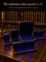 Boîte à bijoux LED octogonale noire avec bord doré, emballage cadeau pour présentation en magasin