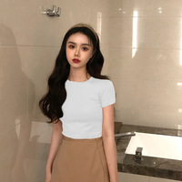 Vente en gros été Sexy couleur unie femmes haut court T-shirts femmes mode T-shirts