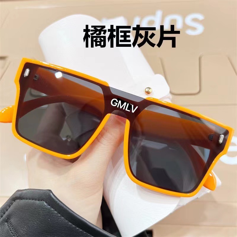 Orange-framed black and gray lenses