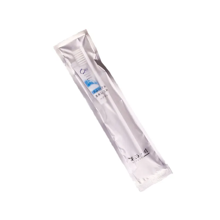 Beautifully packaged disposable plastic toothbrush with toothpaste for travel