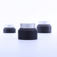 ODM OEM usine 15g 30g 50g pot en verre noir vide pot en verre bouteille pour lotion gommage corporel crème pour les yeux baume à lèvres avec couvercle en aluminium