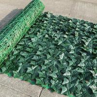 Vente en gros d'herbe verte en plastique artificielle filet de clôture garde-corps décoratif transfrontalier pour la maison bureau feuille de qualité supérieure