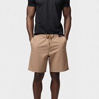 Shorts de sport pour hommes, sublimés, en spandex/polyester, respirants, à séchage rapide, taille élastique, logo sur la jambe gauche, poches