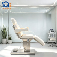 Table de beauté professionnelle électrique avec base en ABS, accoudoirs amovibles, appui-tête extensible et commande au pied