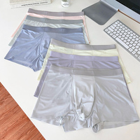 Sous-vêtements en soie glacée sans couture en polyester pour hommes caleçon taille moyenne respirant pantalon en tissu tricoté pour troncs de gros