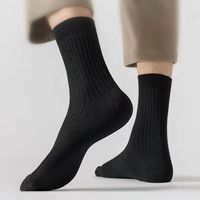 Automne hiver déodorant absorbant la sueur couleur unie haute chaussettes de sport pour hommes longues chaussettes en coton à tube haut