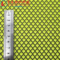 Tissu en maille léger et durable pour femmes, noir et vert, en polyester 100% à mémoire de forme, technique de tricotage sandwich uni teint.