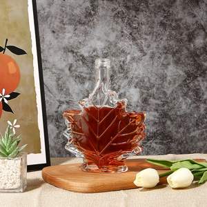 Usine de haute qualité Logo personnalisé en forme de <span class=keywords><strong>feuille</strong></span> clair vide Super Flint bouteille en verre Brandy Tequila bouteille de whisky - Product Image 1
