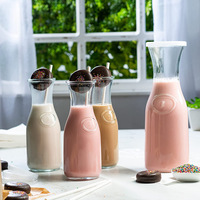Ensemble de 4 carafes en verre transparent de 1 litre avec couvercle pour servir les boissons