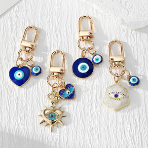 Nouveau design Porte-clés Œil de protection en métal doré avec pendentifs Cœur, Étoile, Hexagone, Amulette porte-bonheur - Product Image 1