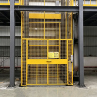 Plateforme élévatrice verticale fixe pour marchandises avec rail de guidage hydraulique et dispositif de protection de sécurité