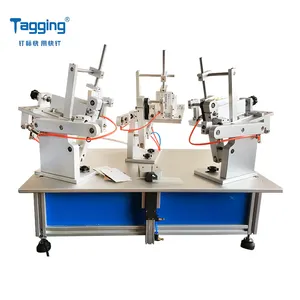 TM8001Tags自動給餌タグ付け機衣類ハードウェア用タグ付け機キッチン用品ラベリングマシン