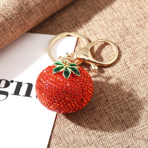 Meilleure vente : Boutons de manchette de luxe léger entièrement ornés de strass, motif kaki, pour filles, avec pendentif porte-clés de sac de voiture en forme de fruit, sensation haut de gamme, style sportif - Product Image 3