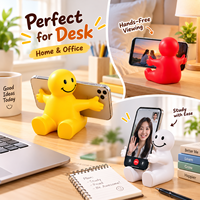 Support de téléphone portable de bureau 2-en-1 Happy Dude à bras ouverts en mousse PU anti-stress pour l'éducation