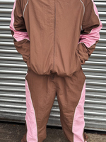 Ensemble de survêtement de sport personnalisé en deux pièces, style streetwear, en nylon avec piping réfléchissant, veste coupe-vent et pantalon de jogging