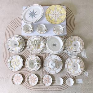 Service de table en céramique de luxe européen à vendre, 41 pièces, avec assiette de présentation, motif étoile, collection en porcelaine osseuse - Product Image 1