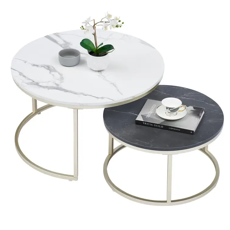 2 Nesting Tables features a gleaming gold base and marble-inspired tops coffee table home furniture