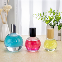 A-Best Flacon de parfum rond en verre haut de gamme avec pulvérisateur et impression sérigraphique disponible en tailles 30ml/50ml/100ml