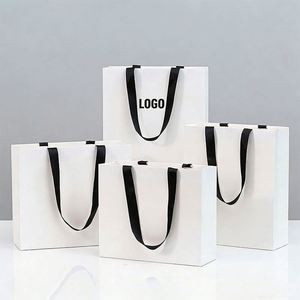 Wholesale Custom White Paper Shopping Bag With Black <b>Ribbon</b> Handle Ideal for Apparel Retail & Takeaway Packaging - Product Image 1