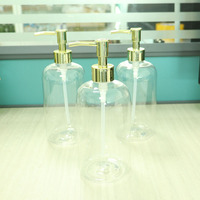 Bouteille pulvérisateur transparente en PET de 600 ml avec impression de logo couleur personnalisée pour le lavage des mains, la lotion corporelle et le shampoing