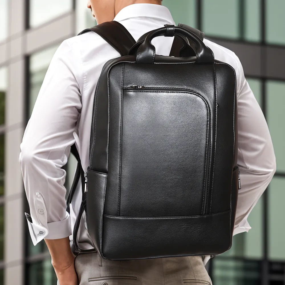 حقيبة ظهر كمبيوتر محمول من الجلد الأصلي بإصدار جديد إنجليزي حقيبة عمل بتصميم ناعم حقيبة ظهر كمبيوتر مدرسية عصرية باللون الأسود للرجال والنساء