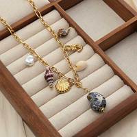 Collier en acier inoxydable 304 sans nickel, plaqué or et rhodium, avec chaîne câble et breloques multiples étoiles de mer et coquillages marins