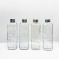 Bouteille d'eau en verre sodocalcique texturé gaufré de grande capacité 1000 ml