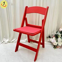 Chaise pliante moderne en résine plastique blanche, capacité 450 kg, idéale pour mariages en extérieur, fêtes, hôtels, salles à manger, cuisines et salons.