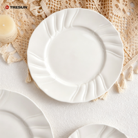Assiettes de présentation rondes en céramique ivoire gaufrée de style italien, en porcelaine, pour mariage, vente en gros d'usine