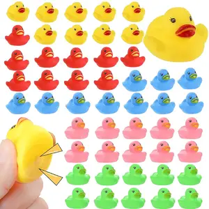 Fábrica al por mayor logotipo personalizado Squeeze amarillo a granel juguetes de goma niños ducha natación baño juguete sonido patos flotantes para bebé