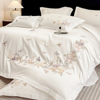 Ensemble de quatre pièces de draps, taies d'oreiller et housses de couette en coton à fibres longues brodées de fleurs