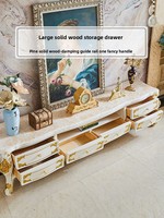 Meuble TV en bois massif de style européen, table basse de luxe en marbre blanc sculpté couleur or champagne, et armoire de sol combinée pour salon