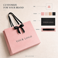 Sacs cadeaux en papier cosmétique de luxe en carton rose avec poignées en ruban noir pour l'emballage de coffrets cadeaux de beauté en gros