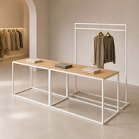 Table de présentation modulaire pour vêtements avec porte-vêtements autoportant pour l'aménagement des boutiques et des magasins de mode