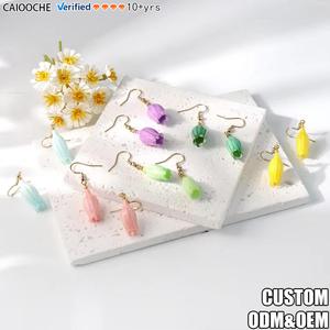 CAIOOCHE Boucles <span class=keywords><strong>d</strong></span>'oreilles pendantes haut de gamme <span class=keywords><strong>en</strong></span> acier inoxydable, motif muguet émaillé coloré à pompon, longues et super éthérées - Product Image 1