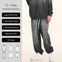 Pantalon de jogging unisexe imprimé effet éclaboussures, coupe fuselée, taille élastique avec cordon de serrage, poches latérales, bas de jambe à revers, style streetwear, effet vieilli, personnalisable, vente en gros