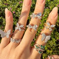 Vente en gros de bagues en argent 925 plaqué or 18 carats avec pierre émeraude taillée, design à trois couches de zircon, bague papillon, bijoux tendance